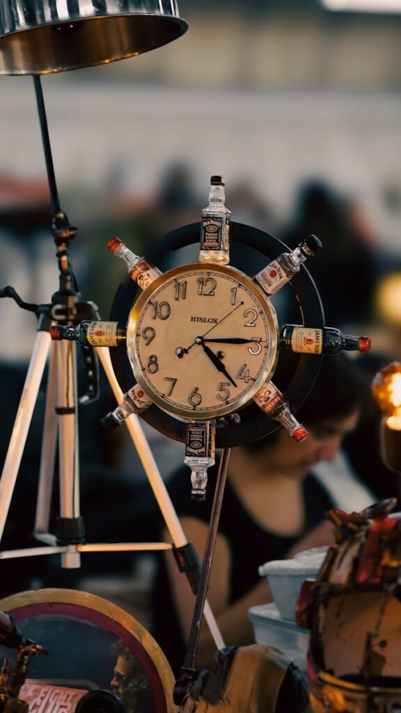 A unique clock design incorporating whiskey bottles as decoration.